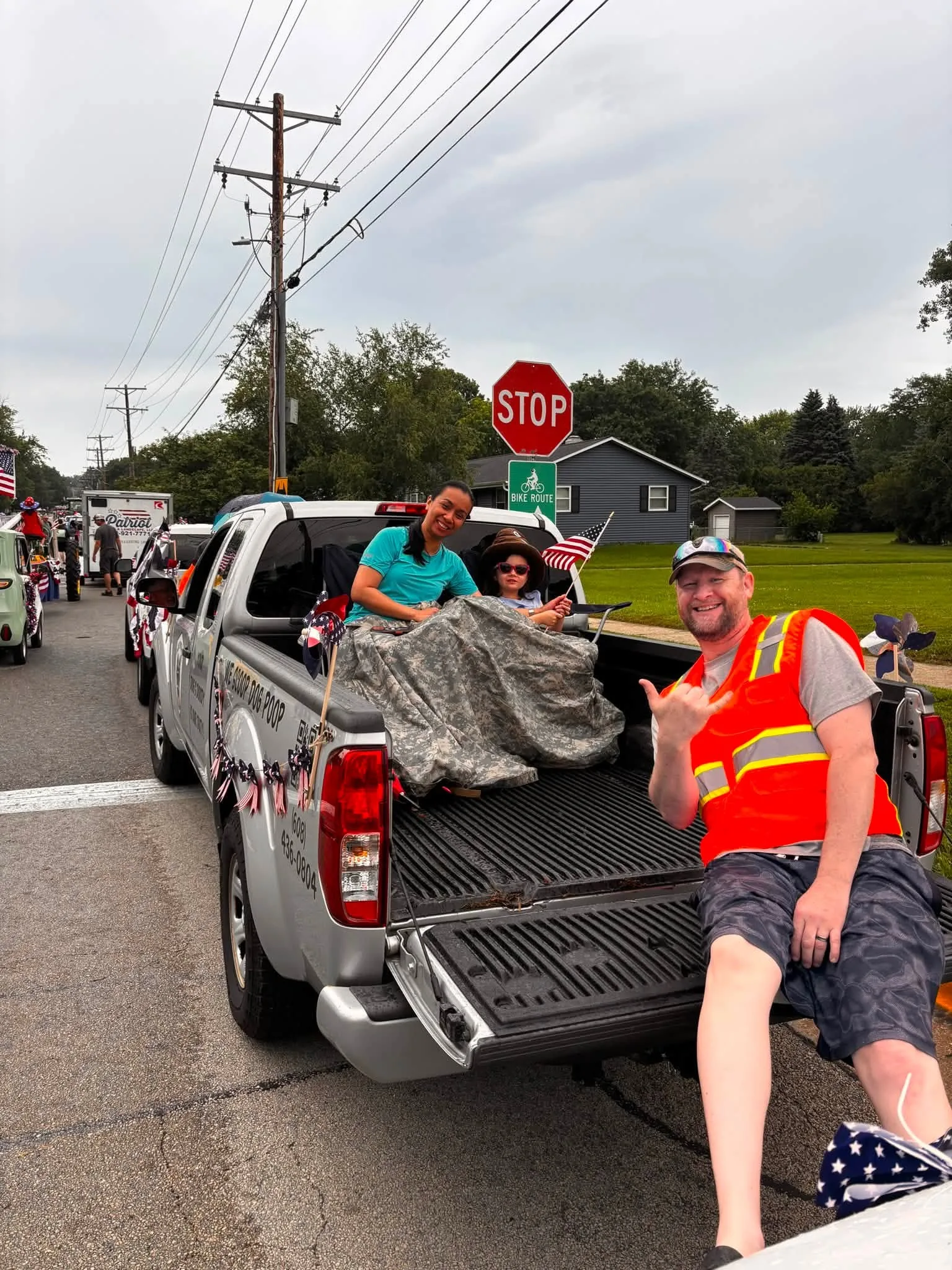 Out in the community — Poo Patrol joining a local parade, because we live and work here too.